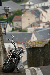 parked motobike with town in the background