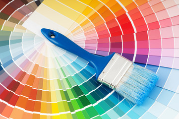 color palette and brush with blue handle