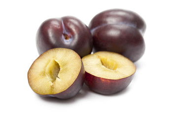 Plums on white background