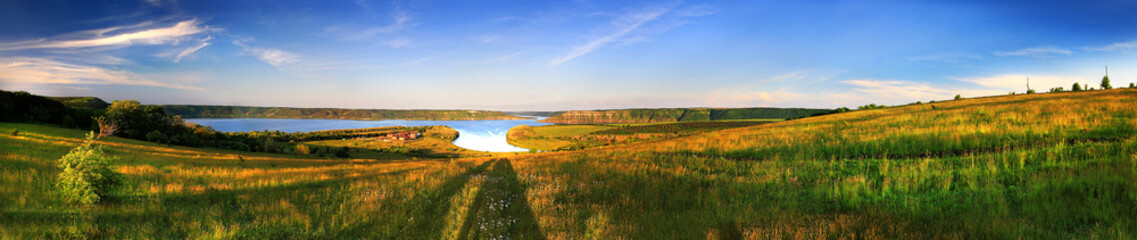 Summer landscape with green fileds and the blue sky