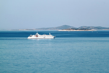 Fototapeta na wymiar Small cruiser sailing outside in Croatia