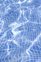 Fototapeta premium Waves on a surface of water in pool