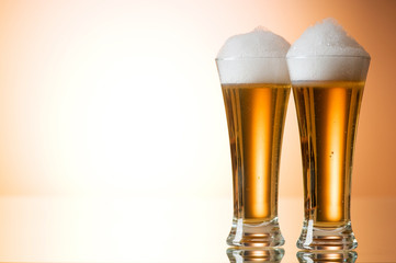 Beer glasses against the colorful gradient background