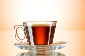 Cup of tea on the reflective surface
