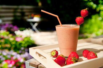 Strawberry smoothie in the garden