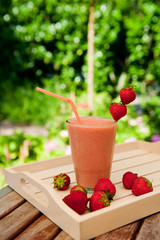 Strawberry smoothie in the garden
