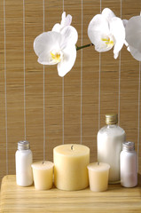 relaxing spa with candles orchids ,oils on wooden background