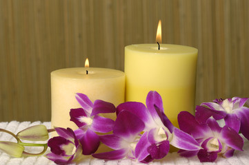 Aromatherapy candles and pink orchid