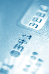 Close up of credit card (blue toned)