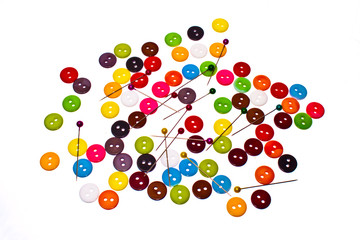 buttons of many colors on a white background