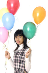 Fototapeta na wymiar Asian teenage girl with balloons