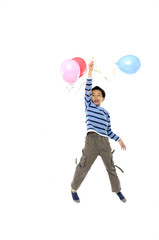 happy boy with colorful balloons over white