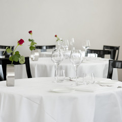 Empty served restaurant table with rose