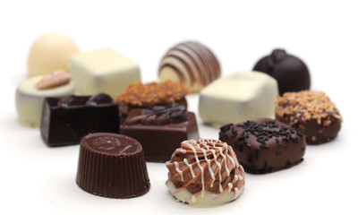 Belgian chocolates on white, shallow depth of field