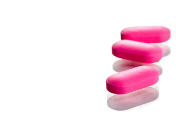 closeup of a pack of pink pills