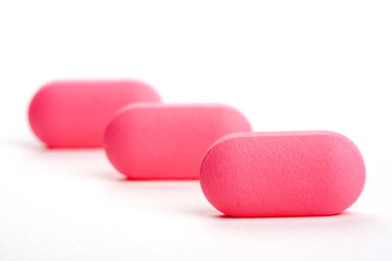 closeup of a pack of pink pills