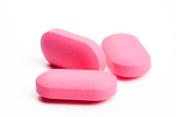 closeup of a pack of pink pills