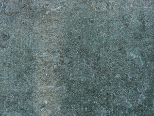 dirty gray worn wall with blue color from bronze