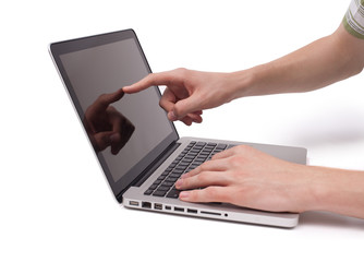 hand pointing to a laptop