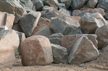 The big stones of a granite lie in a heap