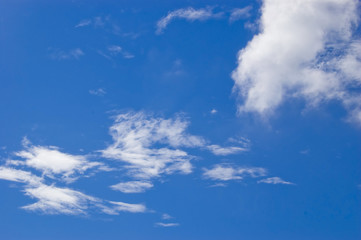 Naklejka na ściany i meble Clouds in the sky on a sunny day