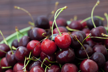 cherry in plate on a bamboo mat