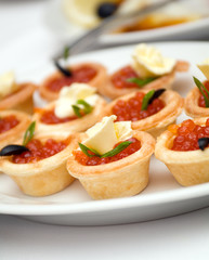 Canapes with red caviar   .