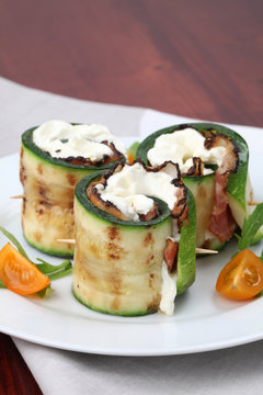 Zucchini rolls with pepper crusted bacon and cheese
