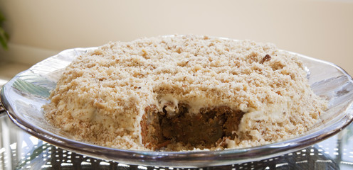Delicious Carrot and Walnut Cake with a Piece Taken Out