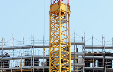 Fototapeta na wymiar scaffolding and cranes