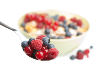 fresh berries in spoon isolated