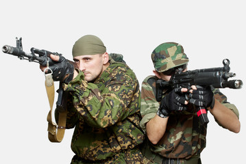 Portrait of soldiers with an automatic assault rifles