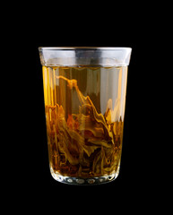 Glass of green tea isolated on black