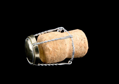 Champagne cork isolated on black background