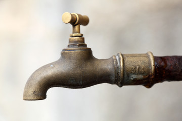 Old rusty brass water tap