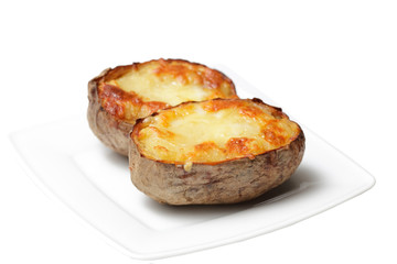 two halves of potato on a white plate