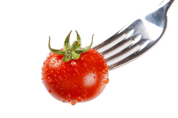 fresh tomato on the fork