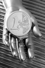 euro silver coin of futuristic metallic silver hand