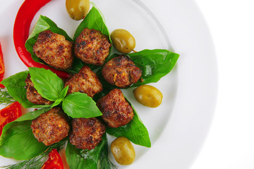 meat balls on basil leaf
