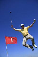 GOLF - lucky golfer is jumping in the air