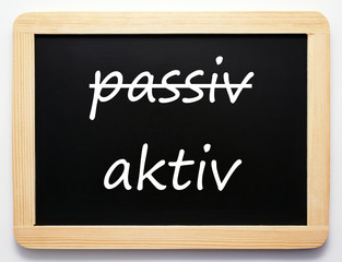 Obraz premium aktiv / passiv - Konzept Schild