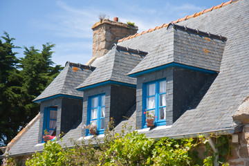 Breton house with typical dormers and shutters, France - obrazy, fototapety, plakaty