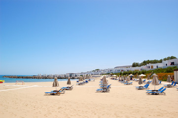 Sunbeds at the beach of luxury hotel, Crete, Greece