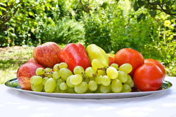 Fresh fruit on the table in the garden