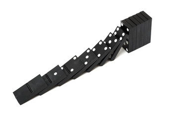 Stack of dominoes falling. Isolated on a white background