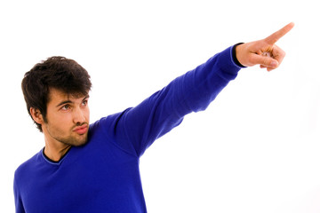 Young casual man pointing with is finger on white background