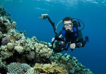 Naklejka na ściany i meble underwater photographer