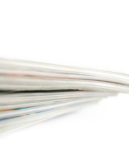 Stack of magazines on white