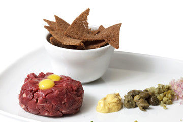 Meat and crackers on a plate. isolated on a white background