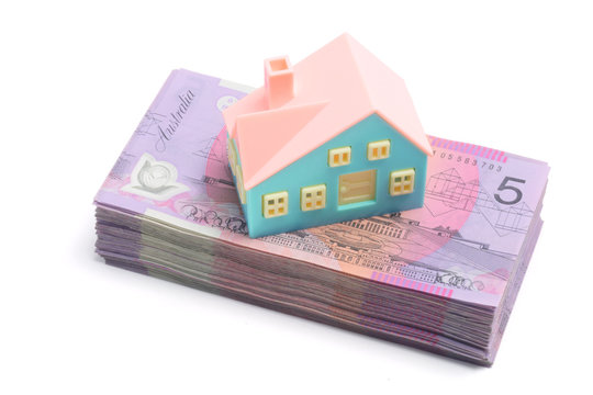 Stack of Notes with Miniature House
